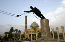 A statue of Iraq's President Saddam Hussein falls